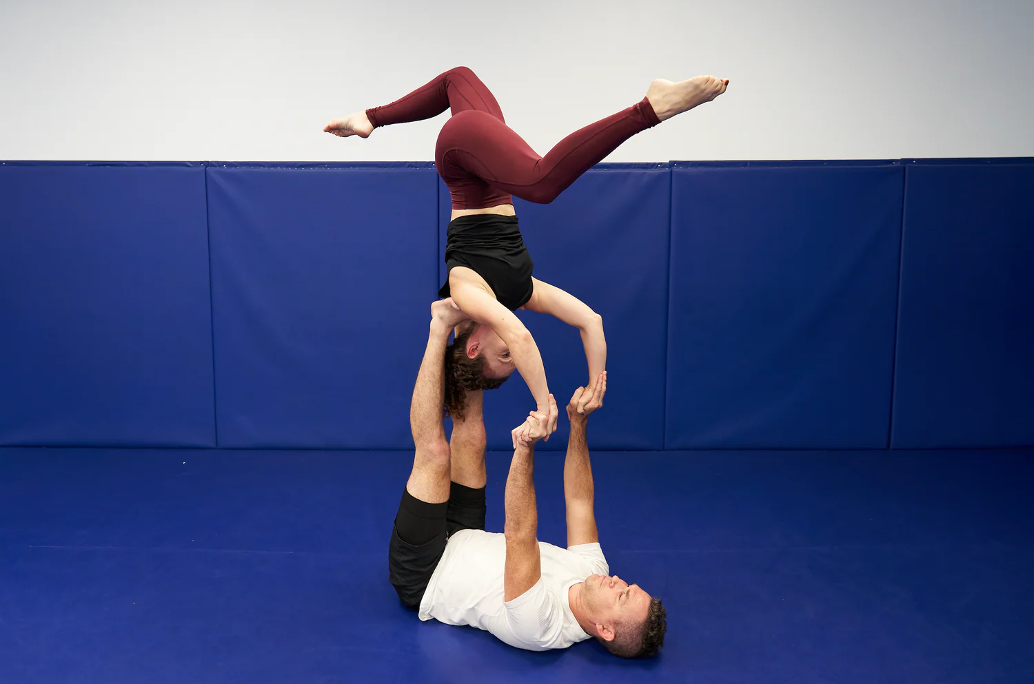 A funny acroyoga throne pose