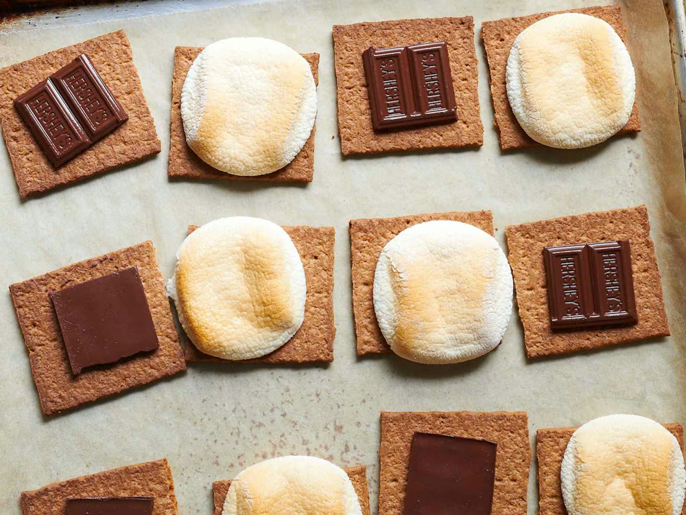 Toasted marshmallows, chocolate, and graham crackers ready for s’mores